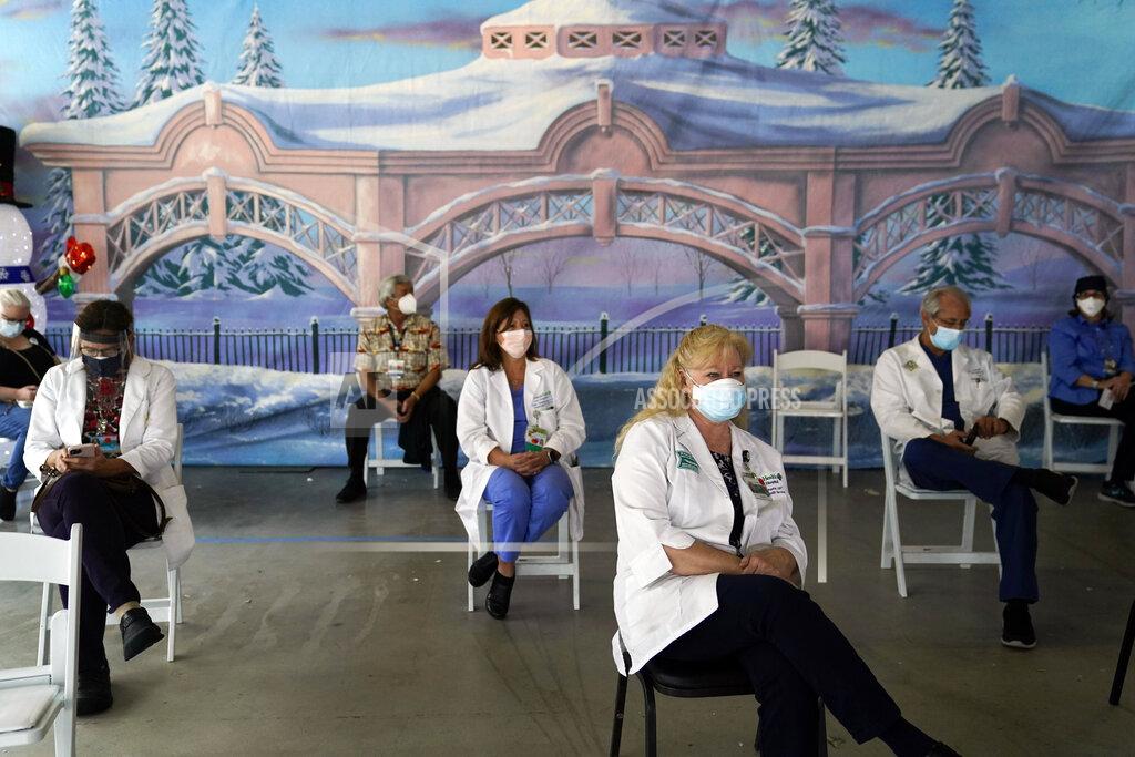 Jae C. Hong FILE - In this Jan. 7, 2021, file photo, medical workers wait in the holding area after getting the Pfizer-BioNTech COVID-19 vaccine at St. Joseph Hospital in Orange, Calif. The rapid expansion of vaccinations to senior citizens across the U.S. has led to bottlenecks, system crashes and hard feelings in many states because of overwhelming demand for the shots. (AP Photo/Jae C. Hong, File)