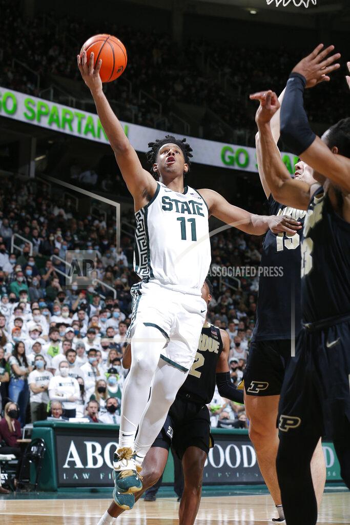 Al Goldis Michigan State's A.J. Hoggard, left, goes up for a shot against Purdue's Jaden Ivey, right, and Zach Edey during the second half of an NCAA college basketball game, Saturday, Feb. 26, 2022, in East Lansing, Mich. Michigan State won 68-65. (AP Photo/Al Goldis)