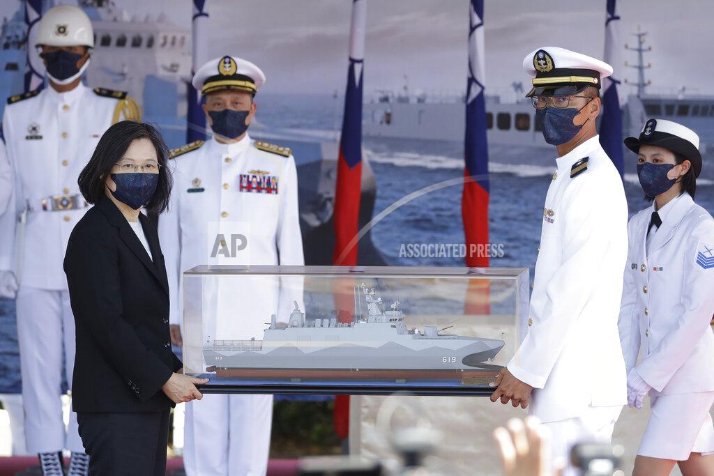 Chiang Ying-Ying Taiwan's President Tsai Ing-wen, left, holds a model ship during the commissioning ceremony of the the domestically made Ta Jiang warship at the Suao naval base in Yilan county, Taiwan, Thursday, Sept. 9, 2021. Taiwan's president oversaw the commissioning of a new domestically made navy warship Thursday as part of the island's plan to boost indigenous defense capacity amid heightened tensions with China. (AP Photo/Chiang Ying-ying)