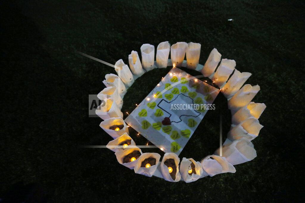 Briana Sanchez There are 23 luminarias lit at Cleveland Square Park honoring the victims of the El Paso shooting Aug. 3, 2019, Thursday night in downtown El Paso. (Briana Sanchez/The El Paso Times via AP)