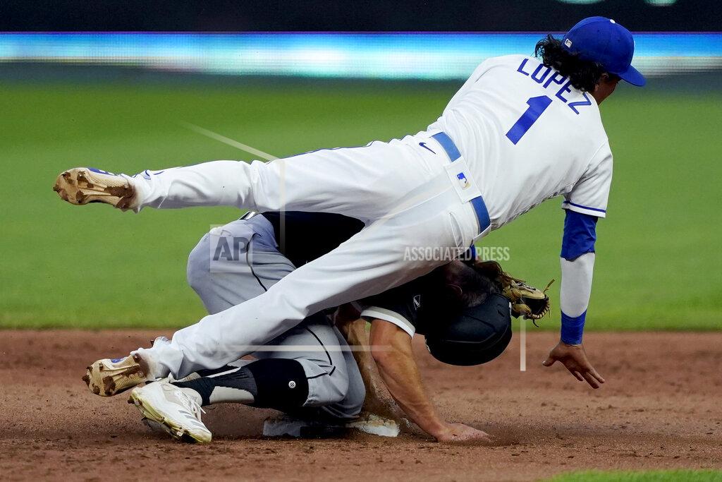 Charlie Riedel Kansas City Royals second baseman Nicky Lopez falls over Chicago White Sox's Adam Engel after forcing him out at second on a double play hit into by Nick Madrigal during the fifth inning of a baseball game Saturday, Aug. 1, 2020, in Kansas City, Mo. (AP Photo/Charlie Riedel)