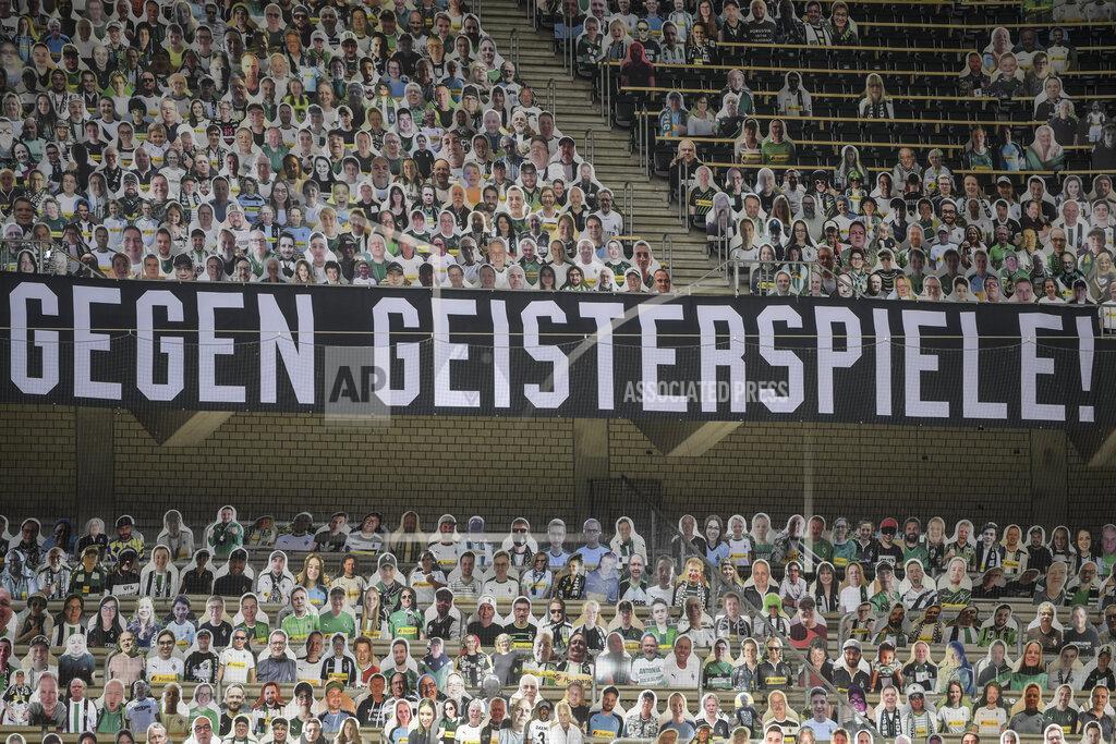 Ina Fassbender A banner reading "Against ghost matches" is displayed during the German Bundesliga soccer match between Borussia Moenchengladbach and Leverkusen, in Moenchengladbach, Germany, Saturday, May 23, 2020. (Ina Fassbender Pool Photo via AP)