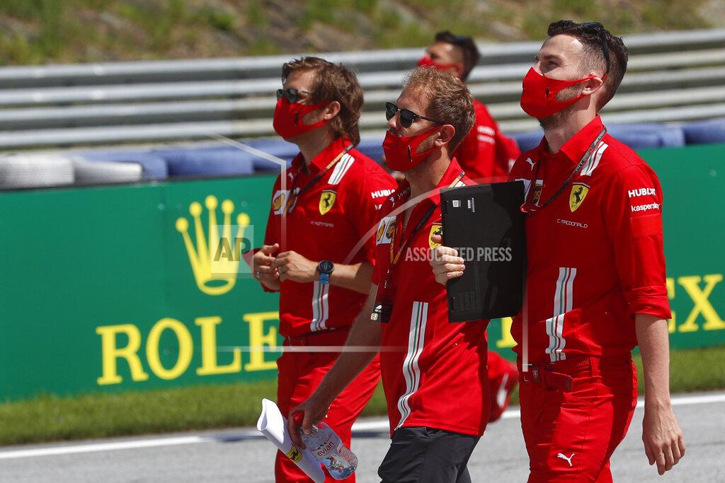 Darko Bandic Ferrari driver Sebastian Vettel, center, inspects the track with his team at the Red Bull Ring racetrack in Spielberg, Austria, Thursday, July 2, 2020. Austrian Formula One Grand Prix will be held on Sunday. (AP Photo/Darko Bandic)