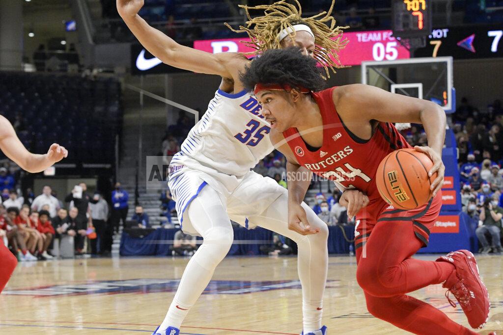 Mark Black Rutgers' Ron Harper Jr. (24) drives around DePaul's Brandon Johnson (35) during the first half of an NCAA college basketball game Thursday, Nov. 18, 2021, in Chicago. (AP Photo/Mark Black)
