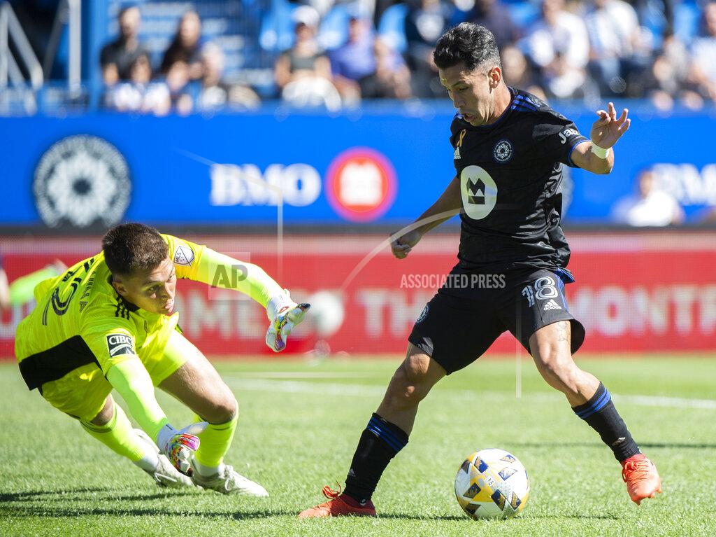 Graham Hughes CF Montreal's Joaquin Torres, right, moves in on Chicago Fire FC goalkeeper Gabriel Slonina during first half MLS soccer action in Montreal, Sunday, Sept. 19, 2021. (Graham Hughes/The Canadian Press via AP)