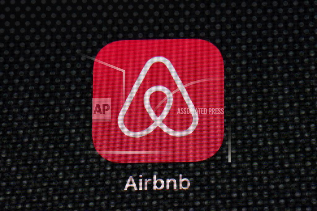The Airbnb app icon is seen on an iPad screen, Saturday, May 8, 2021, in Washington. Airbnb reported Thursday, May 13 that its first-quarter loss more than tripled, to $1.17 billion, as travel remained depressed by the pandemic, but revenue topped the same period in 2019. (AP Photo/Patrick Semansky)