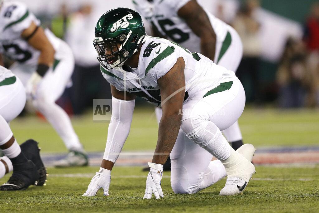 FILE - In this Sunday, Oct. 13, 2019, file photo, New York Jets defensive tackle Quinnen Williams (95) gets set at the line of scrimmage during the second half of an NFL football game against the Dallas Cowboys in East Rutherford, N.J. Brothers and NFL rookies Quinnen and Quincy Williams have more than 60 friends and family members coming to the first game of their lives on opposing teams when the Jets and Jaguars meet. (AP Photo/Steve Luciano, File)
