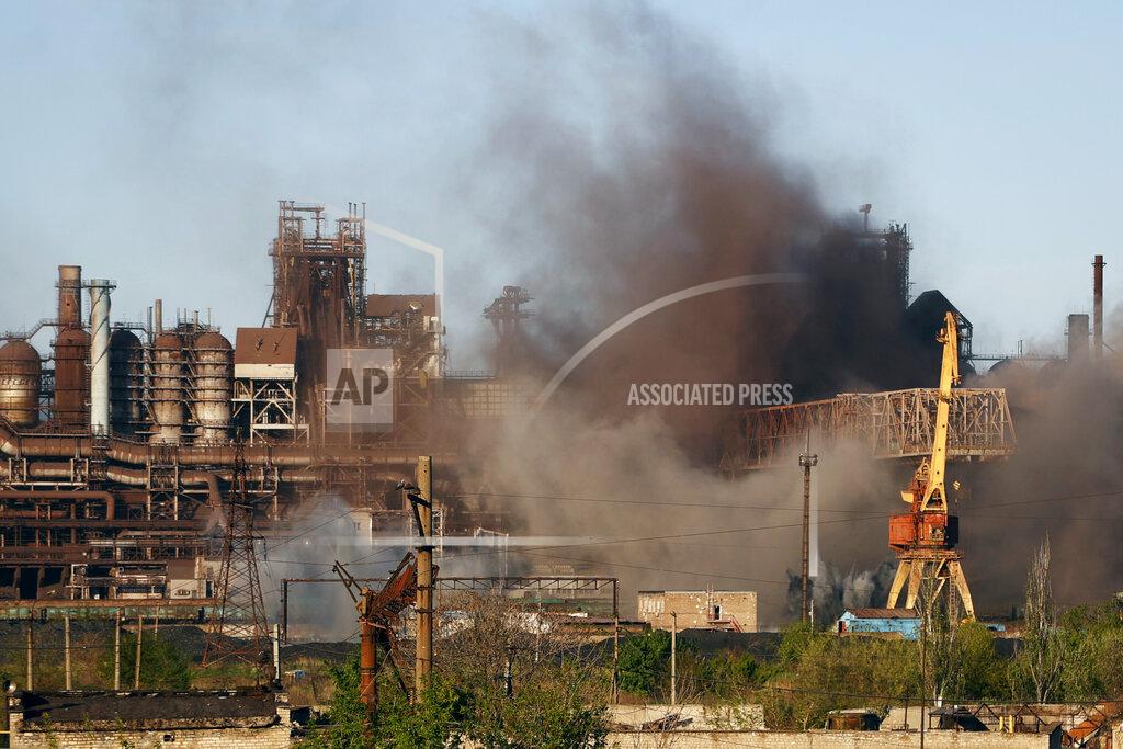 Alexei Alexandrov FILE - Smoke rises from the Metallurgical Combine Azovstal in Mariupol during shelling, in Mariupol, in territory under the government of the Donetsk People's Republic, eastern Ukraine, Saturday, May 7, 2022. Russia claimed to have captured Mariupol on Friday in what would be its biggest victory yet in its war with Ukraine, after a nearly three-month siege that reduced much of the strategic port city to a smoking ruin. (AP Photo/Alexei Alexandrov, File)