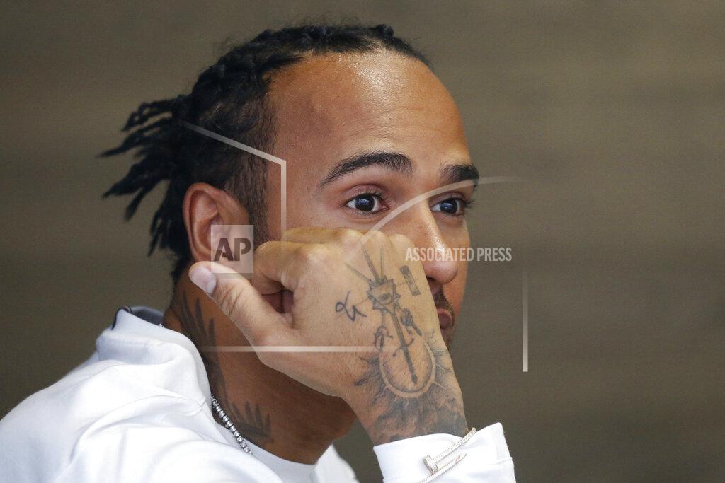 Mercedes driver Lewis Hamilton, of Britain, looks on from the paddock area during a press conference ahead of Sunday's Formula One Brazilian Grand Prix, at the Interlagos racetrack in Sao Paulo, Brazil, Thursday, Nov. 14, 2019. (AP Photo/Nelson Antoine)