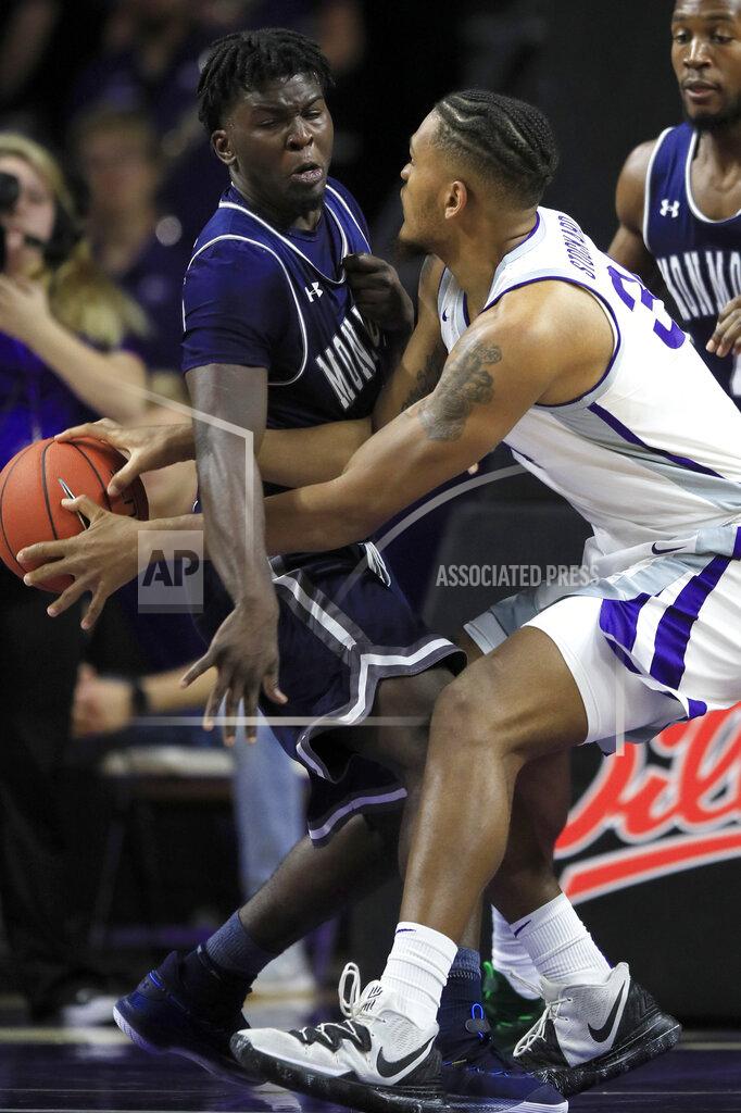 Orlin Wagner Kansas State forward Levi Stockard III, right, passes the ball past around Monmouth guard Ray Salnave during the first half of an NCAA college basketball game in Manhattan, Kan., Wednesday, Nov. 13, 2019. (AP Photo/Orlin Wagner)