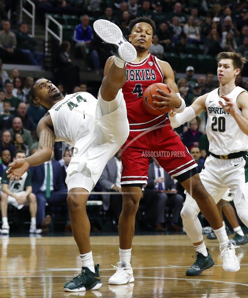 Carlos Osorio Michigan State forward Nick Ward (44) falls next to Northern Illinois forward Lacey James (4) as they fight for the rebound during the first half of an NCAA college basketball game, Saturday, Dec. 29, 2018, in East Lansing, Mich. (AP Photo/Carlos Osorio)