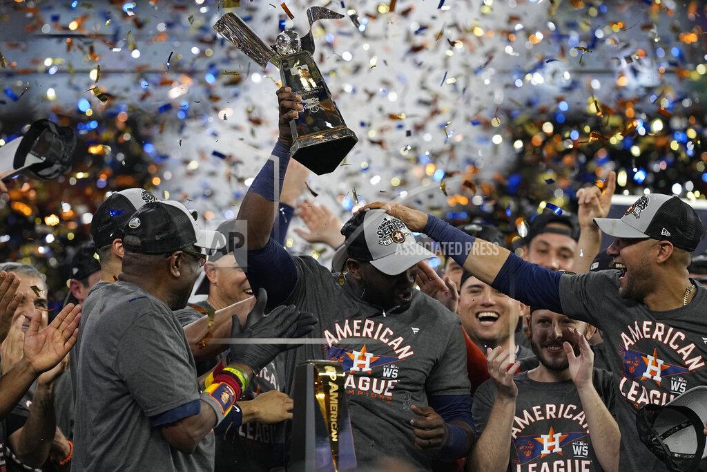 Tony Gutierrez Houston Astros designated hitter Yordan Alvarez holds the trophy after their win against the Boston Red Sox in Game 6 of baseball's American League Championship Series Friday, Oct. 22, 2021, in Houston. The Astros won 5-0, to win the ALCS series in game six.(AP Photo/Tony Gutierrez)