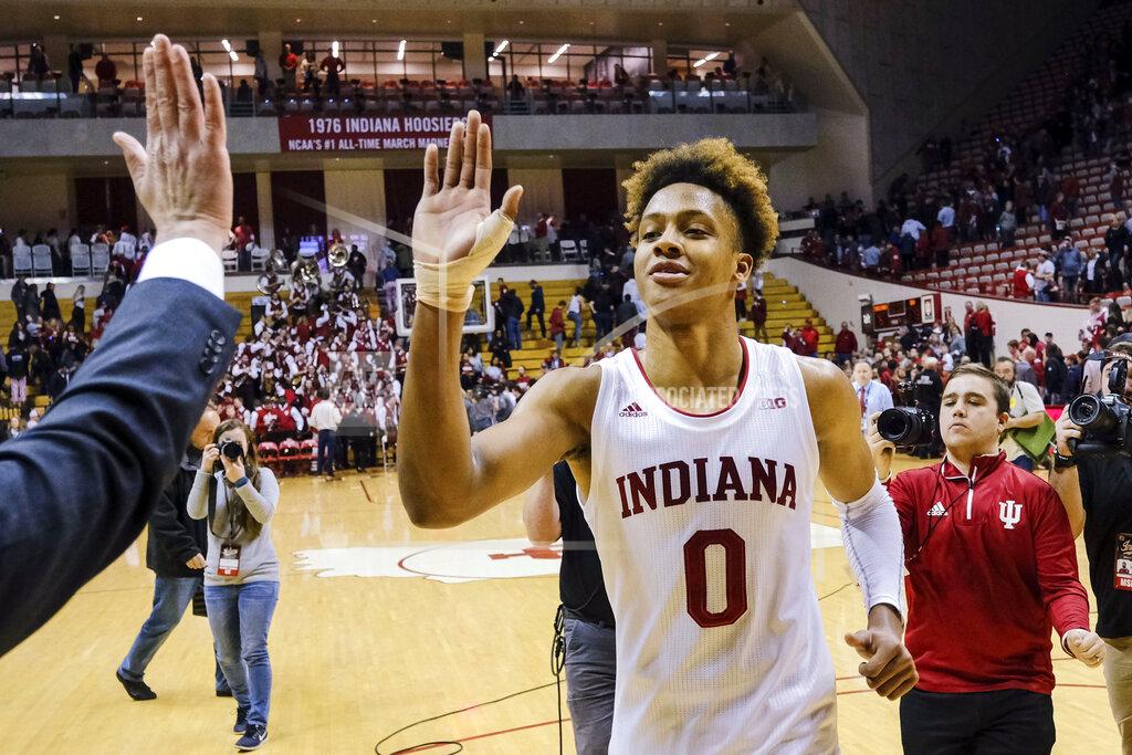 Aj Mast Indiana guard Romeo Langford gets a high-five from a member of the basketball staff after the team's NCAA college basketball game against Wisconsin in Bloomington, Ind., Tuesday, Feb. 26, 2019. Indiana won 75-73 in double overtime. (AP Photo/AJ Mast)