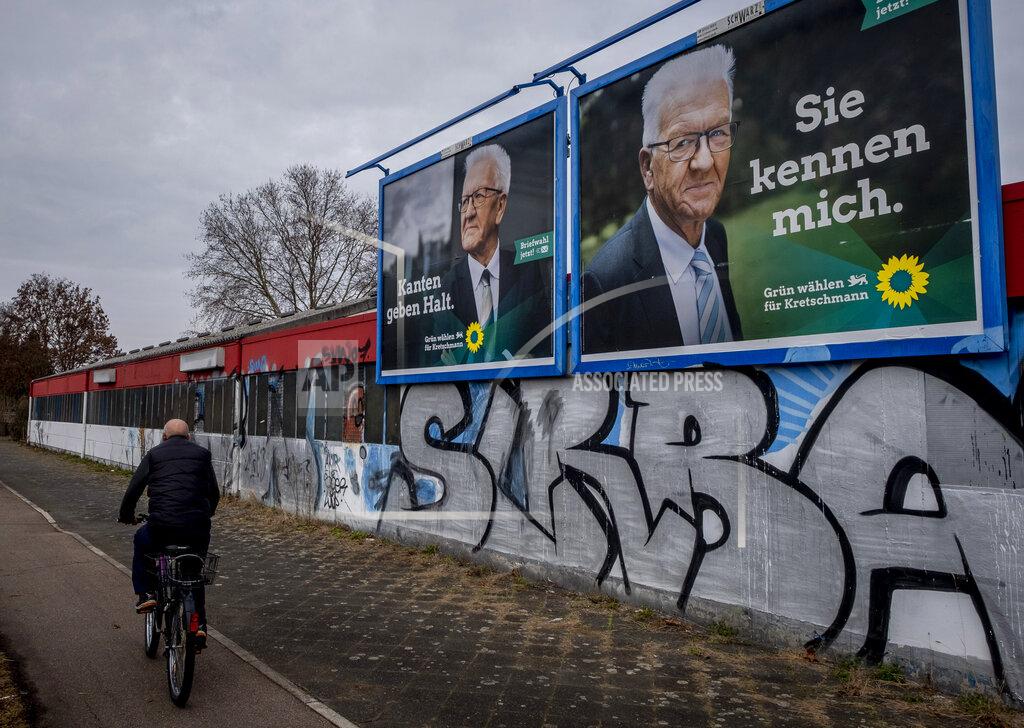 Michael Probst Election posters show Winfried Kretschmann from the Greens and the party's top candidate for the Baden-Wurttemberg federal state elections in Mannheim, Germany, Wednesday, March 10, 2021. The elections will take place next Sunday. Letters on left poster read "edges stabilize", letters on right poster read "you know me". (AP Photo/Michael Probst)