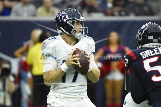 Tennessee Titans quarterback Ryan Tannehill (17) looks to throw against the Houston Texans during the first half of an NFL football game, Sunday, Jan. 9, 2022, in Houston. (AP Photo/Justin Rex )