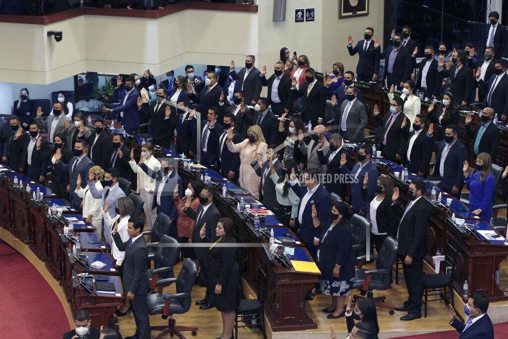 Salvador Melendez Ruling party New Ideas lawmakers are sworn-in at the Congress in San Salvador, El Salvador, Saturday, May 1, 2021. For the first time in three decades the traditional conservative and leftist parties have been sidelined by a resounding electoral defeat, clearing the way for President Nayib Bukele's party to help him advance his agenda. (AP Photo/Salvador Melendez)