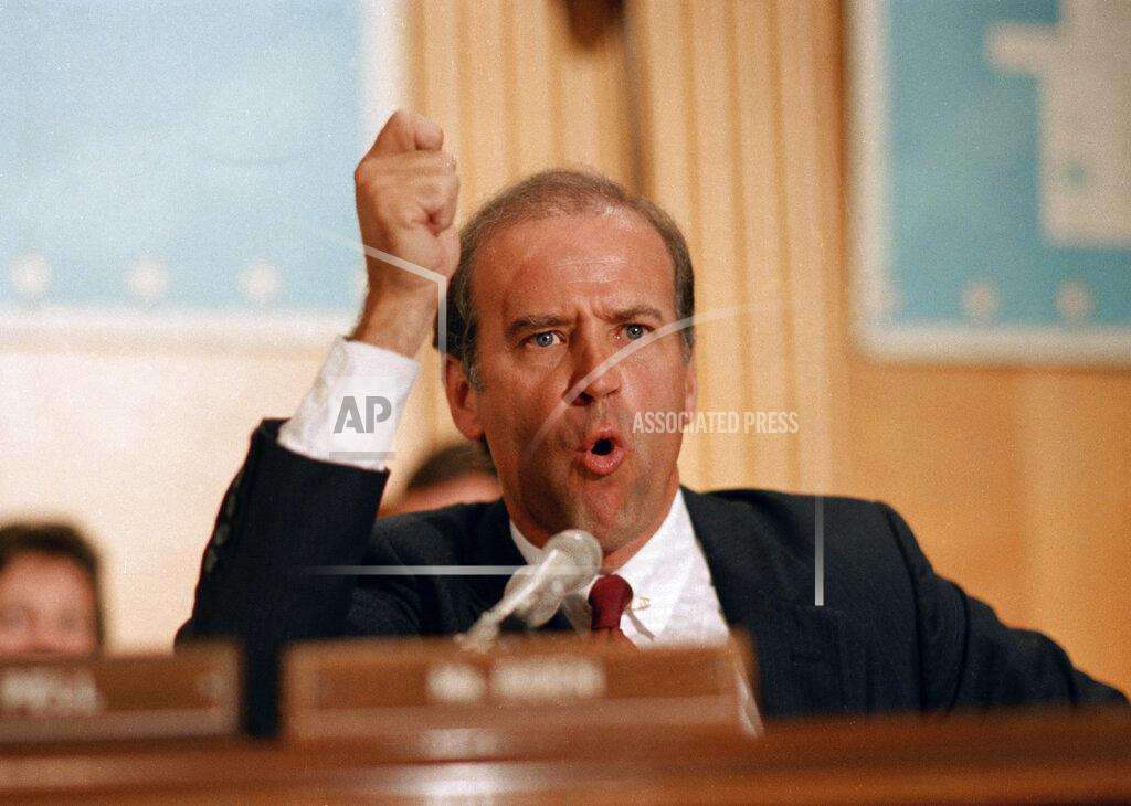 J. Scott Applewhite FILE - In this July 23, 1986 file photo Sen. Joe Biden, D-Del., tells the Senate Foreign Relations Committee and Secretary of State George Shultz that U.S. policy toward South Africa amounted to a shameful lack of backbone on Capitol Hill in Washington. Biden, in a sharp exchange with Shultz, said "blacks have tried everything available to them in the last 20 years," and nothing has worked. (AP Photo/J. Scott Applewhite, File)