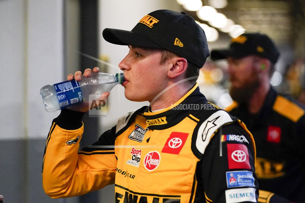 John Raoux Christopher Bell takes a break in his garage during NASCAR Daytona 500 auto race practice at Daytona International Speedway, Friday, Feb. 18, 2022, in Daytona Beach, Fla. (AP Photo/John Raoux)