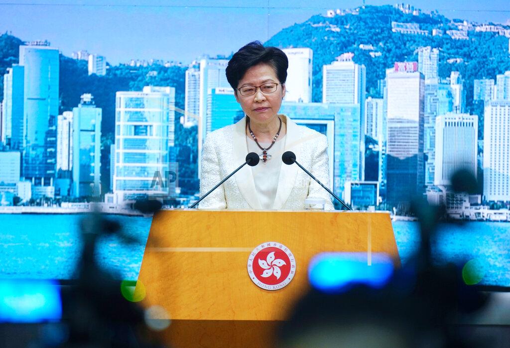 Vincent Yu Hong Kong Chief Executive Carrie Lam listens to questions during a news conference in Hong Kong, Tuesday, May 11, 2021. Lam announced Hong Kong officials have dropped a plan to make it mandatory for foreign domestic workers to be vaccinated against the coronavirus, after the move drew criticism that it was discriminatory. (AP Photo/Vincent Yu)