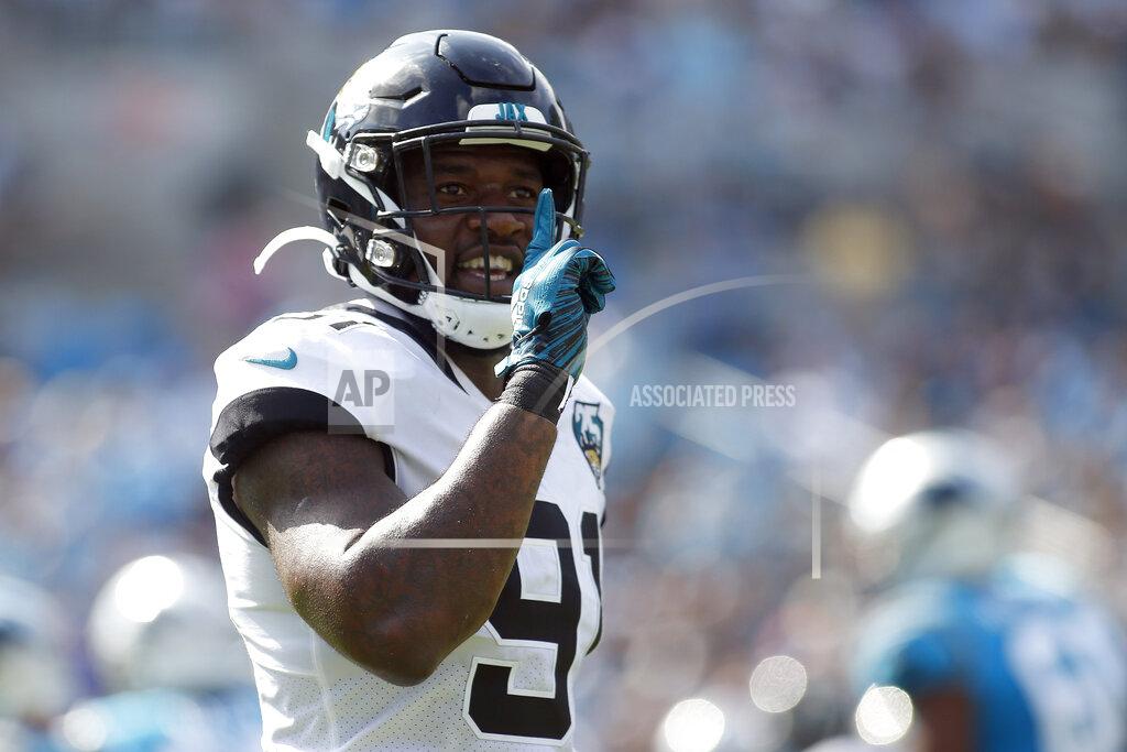 Brian Blanco FILE - Then-Jacksonville Jaguars defensive end Yannick Ngakoue (91) reacts following a play against the Carolina Panthers during the first half of an NFL football game in Charlotte, N.C., Sunday, Oct. 6, 2019. NFL teams can always use more pass rushers, as evidenced by the NFC North where all four teams have spent big to acquire them over the last three years. Minnesota, trying to overtake defending division champ Green Bay, was the latest example with the acquisition of defensive end Yannick Ngakoue.(AP Photo/Brian Blanco, File)