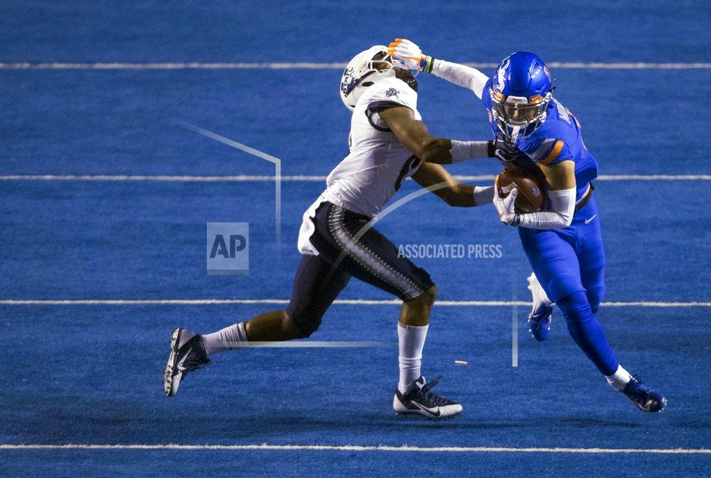 Darin Oswald Boise State wide receiver Sean Modster (8) wrestles with Utah State cornerback Cameron Haney (6) after a catch during an NCAA college football game Saturday, Nov. 24, 2018, in Boise, Idaho. (Darin Oswald/Idaho Statesman via AP)