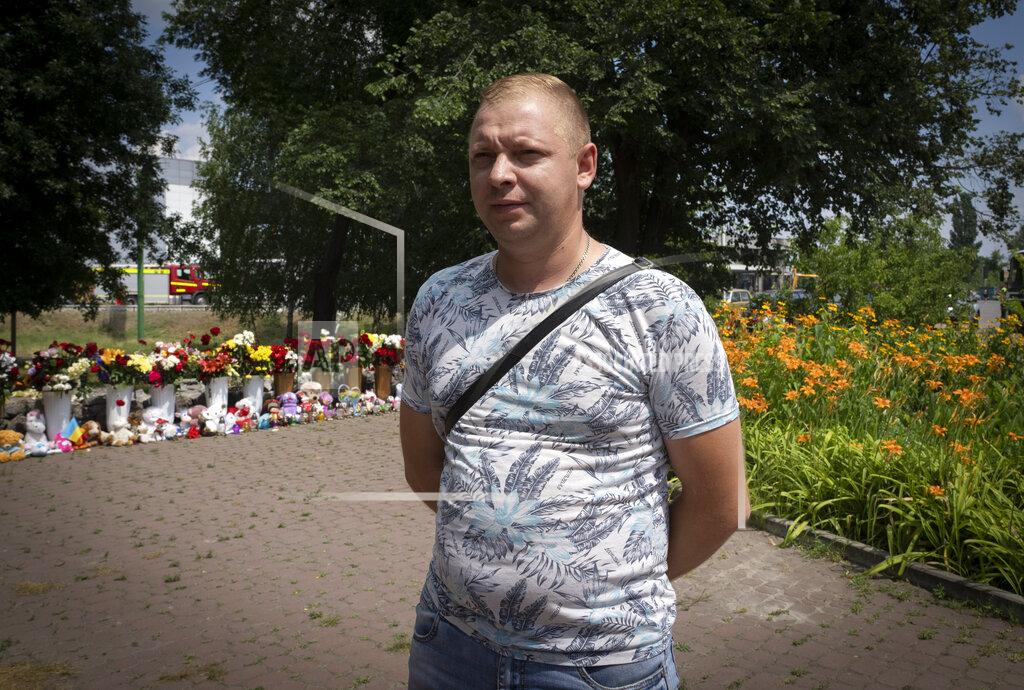 Efrem Lukatsky Oleksandr Baybuza tells about the Russian deadly rocket attack at a shopping center in Kremenchuk, Ukraine, Wednesday, June 29, 2022. Baybuza said he is searching his brother-in-law Kostyantyn Vozniy who was working in the shopping center and is considered missing. Residents of the quiet, riverside city of Kremenchuk are reeling in the wake of a Russian airstrike that obliterated a shopping mall and killed at least 18. With dozens still missing, psychologists are working with families to help them through their grief and toward acceptance that they may never find their loved ones. (AP Photo/Efrem Lukatsky)
