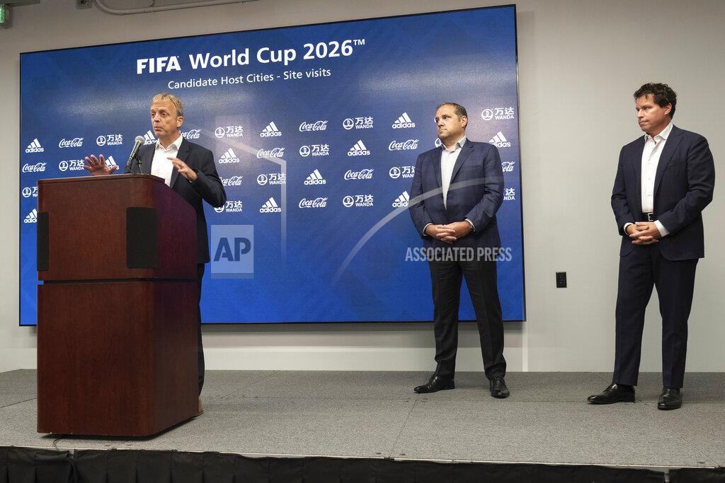 Ben Gray Colin Smith, FIFA Chief Tournaments & Events Officer, answers a question during a press conference Friday afternoon, Sept. 17, 2021 at Mercedes-Benz Stadium in Atlanta, as Victor Montagliani, FIFA vice-president and CONCACAF president, center, and Dan Corso, president of Atlanta Sports Council listen. Officials were touring the stadium as part of the FIFA World Cup 2026 Candidate Host City Tour. (AP Photo/Ben Gray)