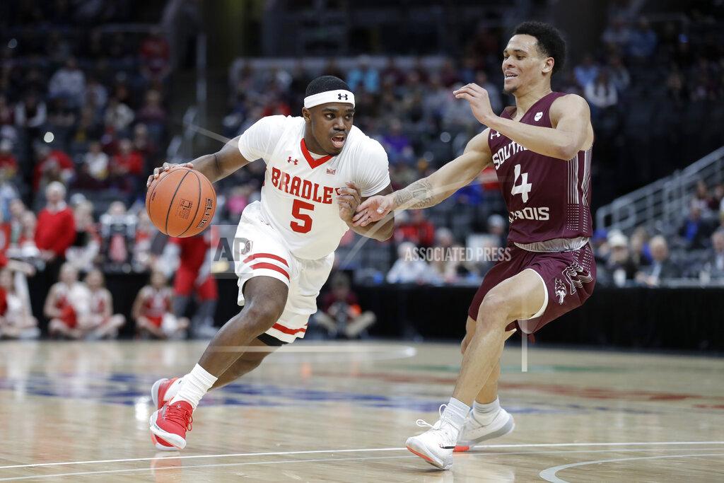 Jeff Roberson Bradley's Darrell Brown Jr. (5) heads to the basket past Southern Illinois' Eric McGill (4) during the first half of an NCAA college basketball game in the quarterfinal round of the Missouri Valley Conference men's tournament Friday, March 6, 2020, in St. Louis. (AP Photo/Jeff Roberson)