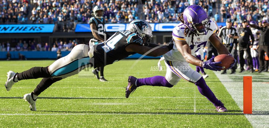 Carlos Gonzalez Minnesota Vikings receiver K.J. Osborn (17) catches a 27-yard touchdown reception as Carolina Panthers safety Sean Chandler (34) defends in overtime of an NFL football game, Sunday, Oct. 17, 2021, in Charlotte, N.C. (Carlos Gonzalez/Star Tribune via AP)