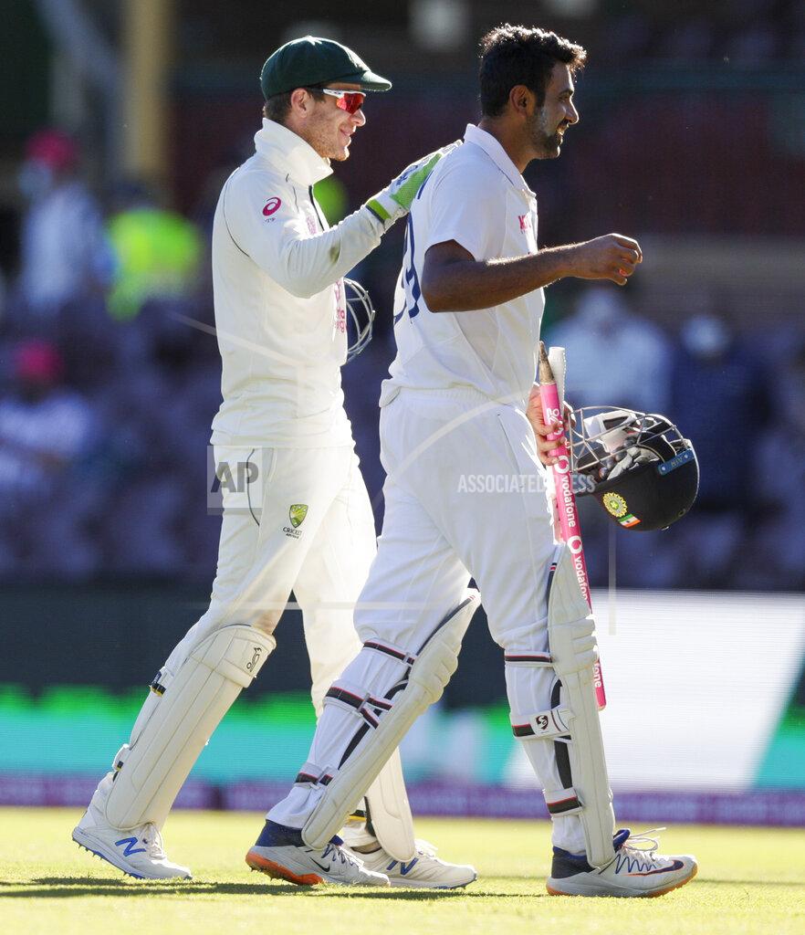 Rick Rycroft Australian captain Tim Paine, left, congratulates not out batsman India's Ravichandran Ashwin following play on the final day of the third cricket test between India and Australia at the Sydney Cricket Ground, Sydney, Australia, Monday, Jan. 11, 2021. The test ended in a draw and the series is at 1-1 all with one test to play. (AP Photo/Rick Rycroft)