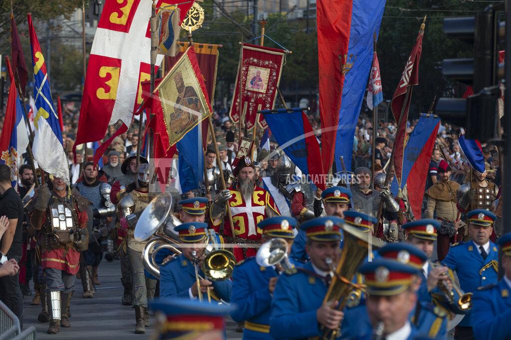 Marko Drobnjakovic Actors portraying knights from various historic periods march together with the Serbian army honor guards during a ceremony to mark the newly established "Day of Serb Unity, Freedom and the National Flag" state holiday in Belgrade, Serbia, Wednesday, Sept. 15, 2021. Serbia has kicked off a new holiday celebrating national unity with a display of military power, triggering unease among its neighbors. (AP Photo/Marko Drobnjakovic)