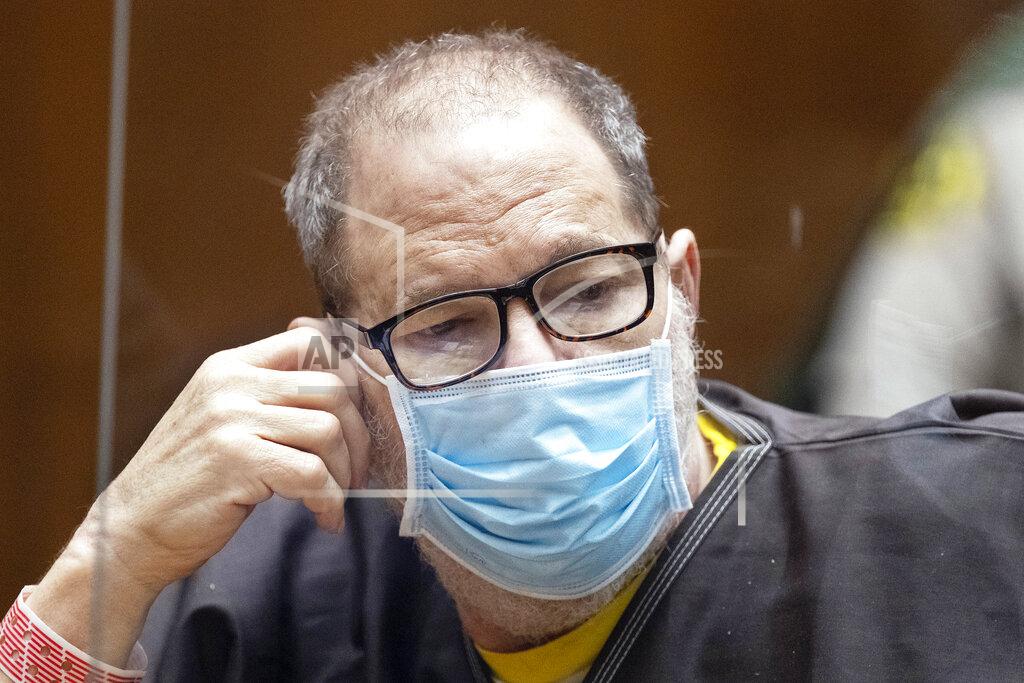 Etienne Laurent Harvey Weinstein, the 69-year-old convicted rapist and disgraced movie mogul, wears a face mask behind a protective plexiglass screen as he listens in court during a pre-trial hearing in Los Angeles, Thursday, 29 July 2021. Weinstein pleaded not guilty Wednesday to four counts of rape and seven other sexual assault counts in California.(Etienne Laurent/Pool Photo via AP)