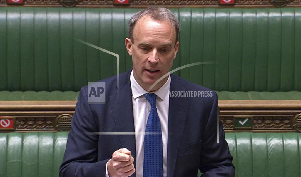 Uncredited In this image taken from video, Foreign Secretary Dominic Raab speaks during Prime Minister's Questions in the House of Commons, London, Wednesday April 22, 2020. U.K. legislators and most parliamentary staff were sent home in late March as part of a nationwide lockdown to slow the spread of the new coronavirus. A few dozen legislators sat, well-spaced, in the Commons, and agreed on arrangements for lawmakers to ask questions from home using videoconferencing program Zoom, beamed onto screens erected around the wood-paneled chamber. (House of Commons via AP)