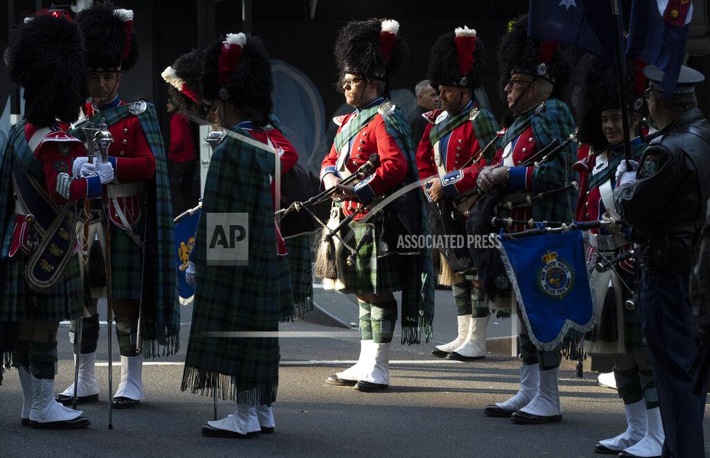 Mark Baker Pipe band members prepare to march in the Anzac Day parade in Sydney, Australia, Sunday, April 25, 2021. Australians and New Zealanders paid tribute to their war dead Sunday as both nations prepared to withdraw from their longest war in Afghanistan. (AP Photo/Mark Baker)