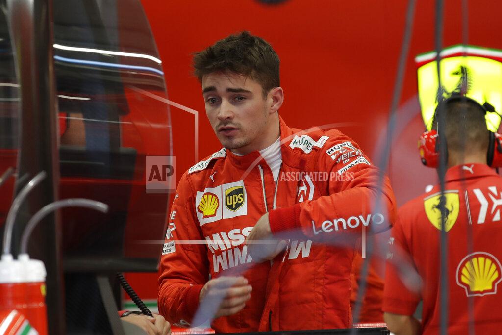 Silvia Izquierdo Ferrari driver Charles Leclerc, of Monaco, unzips his racing suit after his first free practice at the Interlagos race track in Sao Paulo, Brazil, Friday, Nov. 15, 2019. Brazil Formula 1 GP will take place on Sunday. (AP Photo/Silvia Izquierdo)