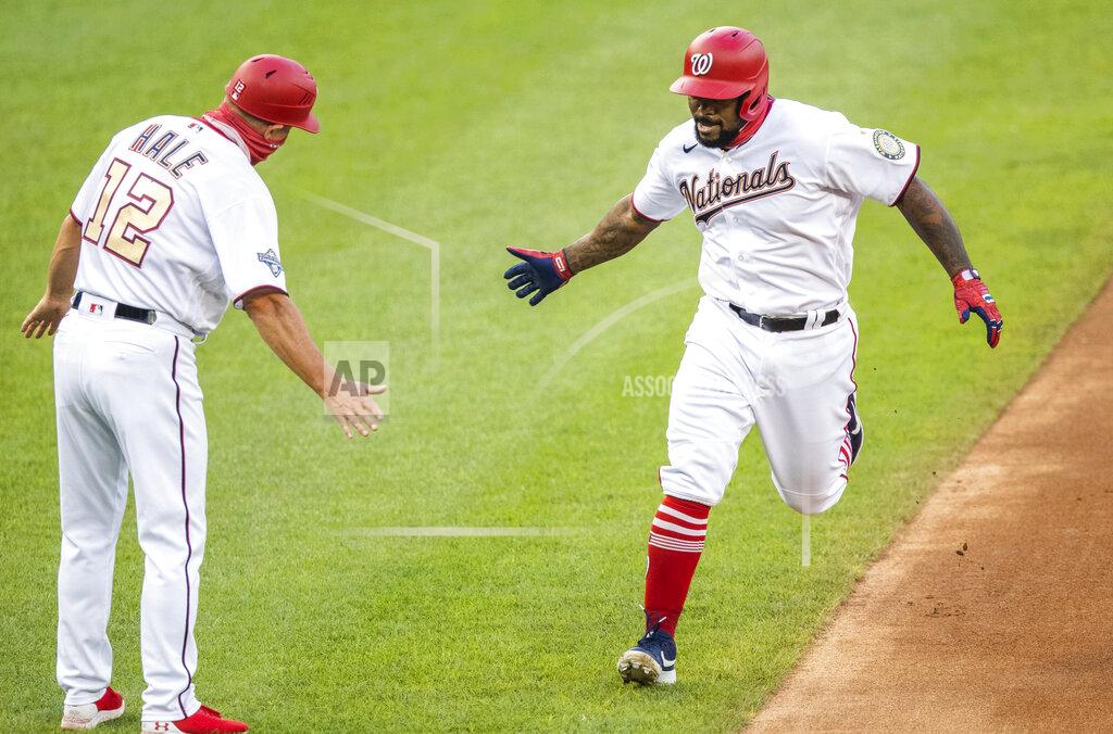 Manuel Balce Ceneta Washington Nationals Howie Kendrick, right, rounds the bases after hitting a home run during the first inning of a baseball game against the New York Mets in Washington, Tuesday, Aug. 4, 2020. (AP Photo/Manuel Balce Ceneta)
