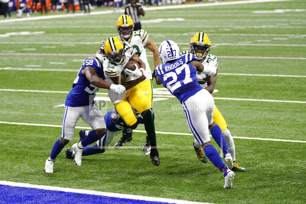 Aj Mast Green Bay Packers wide receiver Davante Adams (17) scores a touchdown while being tackled by dIndianapolis Colts' Bobby Okereke (58) during the first half of an NFL football game, Sunday, Nov. 22, 2020, in Indianapolis. (AP Photo/AJ Mast)