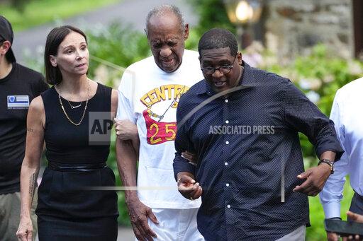 FILE - Bill Cosby, center, and spokesperson Andrew Wyatt, right, and attorney Jennifer Bonjean, left, approach members of the media gathered outside Cosby's home in Elkins Park, Pa., on June 30, 2021. An Illinois judge could be facing discipline after he mocked Bonjean in comments that he apparently did not realize were being broadcast live on YouTube. (AP Photo/Matt Slocum, File)