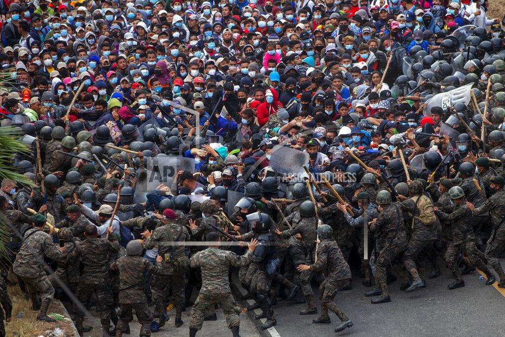 Sandra Sebastian Honduran migrants clash with Guatemalan soldiers in Vado Hondo, Guatemala, Sunday, Jan. 17, 2021. Guatemalan authorities estimated that as many as 9,000 Honduran migrants crossed into Guatemala as part of an effort to form a new caravan to reach the U.S. border. (AP Photo/Sandra Sebastian)