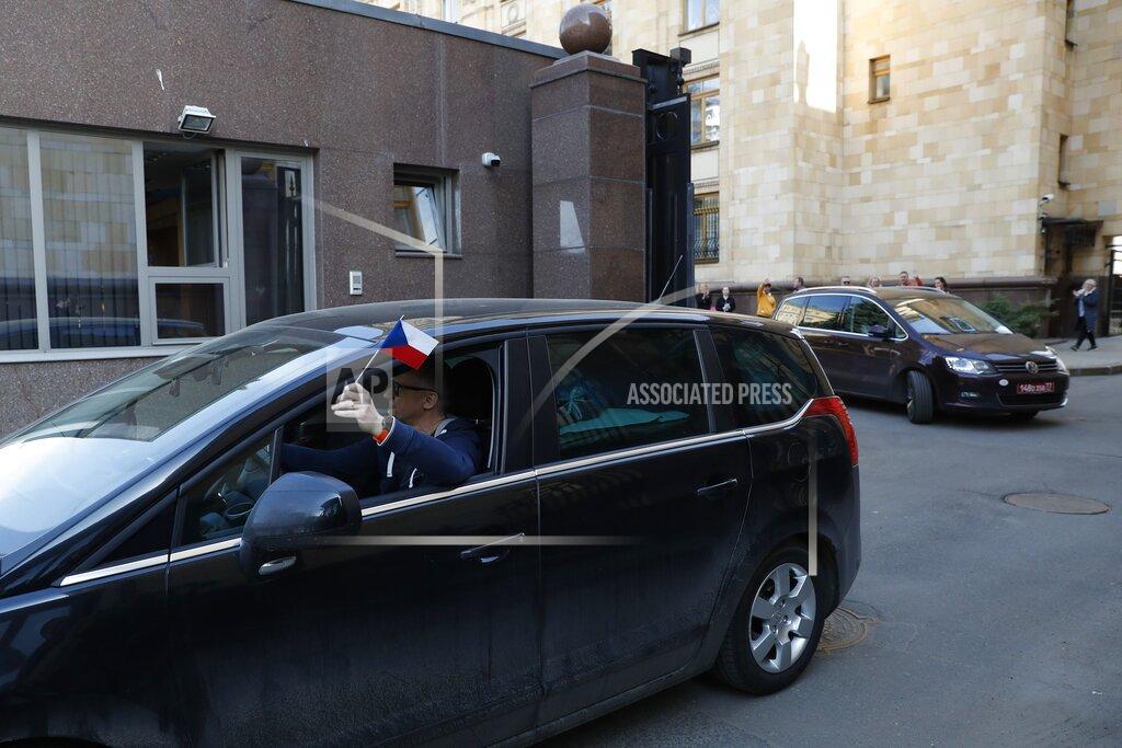 Pavel Golovkin Embassy staff leave the Czech Republic Embassy by a car in Moscow, Russia, Monday, April 19, 2021. Russia has ordered 20 Czech diplomats to leave the country within a day in response to Prague's expulsion of 18 Russian diplomats. The Czech government has alleged the Russian Embassy staffers were spies for a military intelligence agency that was involved in a fatal ammunition depot explosion in 2014. (AP Photo/Pavel Golovkin)