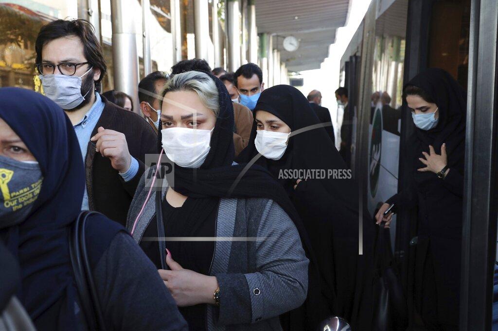 Ebrahim Noroozi FILE - In this Oct. 11, 2020, file photo, people wear protective face masks to help prevent the spread of the coronavirus in downtown Tehran, Iran. Iranian media reported on Monday, Dec. 28 that an unidentified group of U.S.-based philanthropists plans to send 150,000 doses of the Pfizer vaccine to Iran in the coming weeks, in a step that could bring the hardest-hit country in the Middle East closer to inoculating its citizens against the coronavirus. (AP Photo/Ebrahim Noroozi, File)