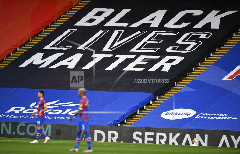 Daniel Leal-Olivas A Black Lives Matter sign covers the seats during the English Premier League soccer match between Crystal Palace and Burnley at Selhurst Park, in London, England, Monday, June 29, 2020. (AP Photo/Daniel Leal-Olivas,Pool)