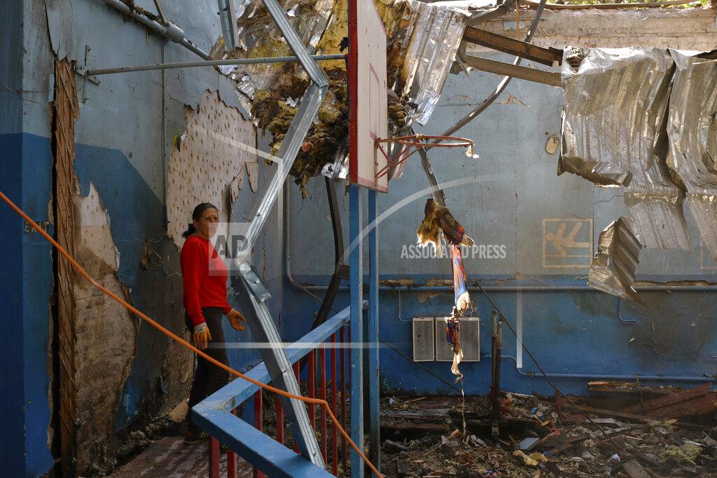 Andriy Andriyenko A sports teacher stands in a destroyed gymnasium of a school after Russian shelling in the village of Druzhkivka, Donetsk region, Ukraine, Monday, May 16, 2022. (AP Photo/Andriy Andriyenko)