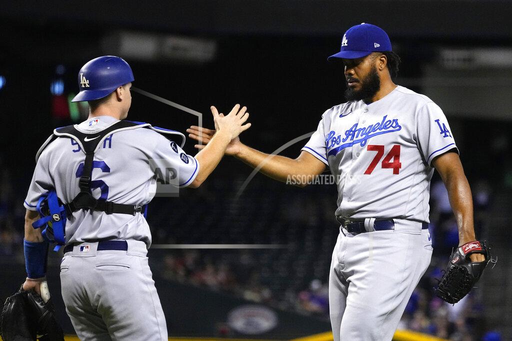 Rick Scuteri Los Angeles Dodgers catcher Will Smith and pitcher Kenley Jansen (74) celebrate after defeating the Arizona Diamondbacks 4-2 during a baseball game, Friday, Sept. 24, 2021, in Phoenix. (AP Photo/Rick Scuteri)