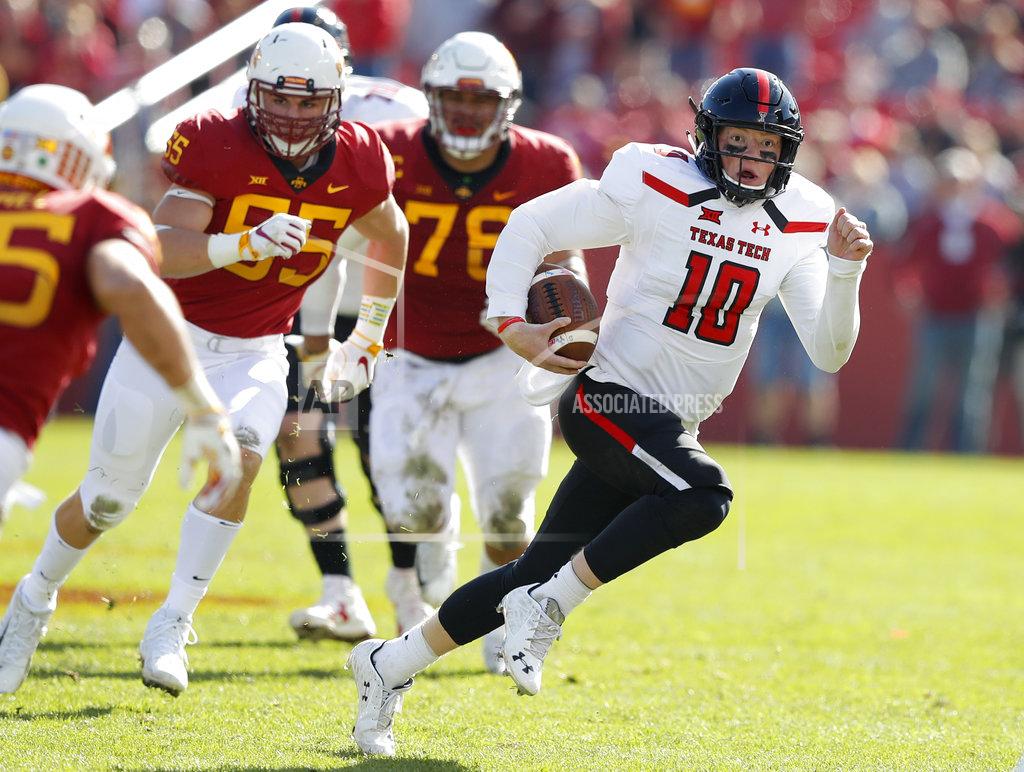 Charlie Neibergall FILE - In this Oct. 27, 2018, file photo, Texas Tech quarterback Alan Bowman runs upfield during the second half of an NCAA college football game against Iowa State in Ames, Iowa. Bowman is the Big 12's leading passer. (AP Photo/Charlie Neibergall, File)