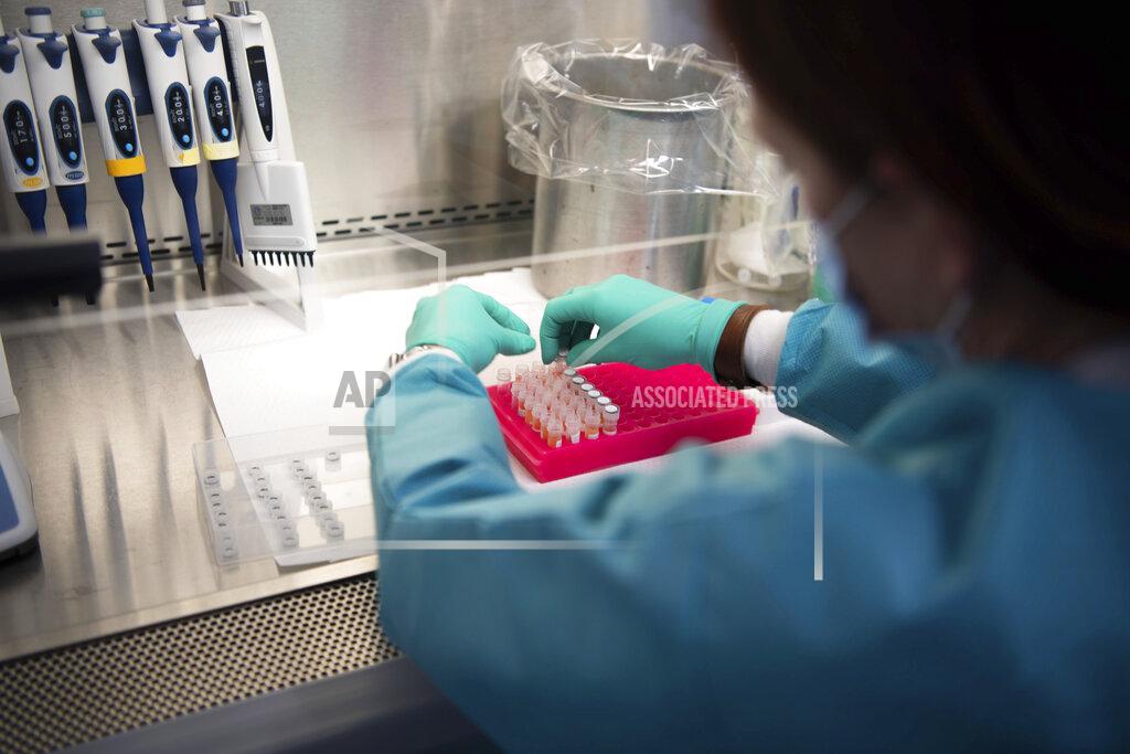 Stephanie Amador Karen Maynard, a laboratory scientist, prepares COVID-19 samples for genome sequencing at the Tennessee public health lab in Nashville, Tenn., Tuesday, Sept. 14, 2021. (Stephanie Amador/The Tennessean via AP)