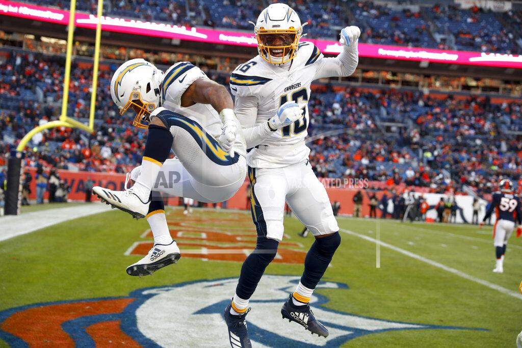 David Zalubowski Los Angeles Chargers running back Austin Ekeler, left, celebrates after scoring with wide receiver Andre Patton during the first half of an NFL football game against the Denver Broncos Sunday, Dec. 1, 2019, in Denver. (AP Photo/David Zalubowski)