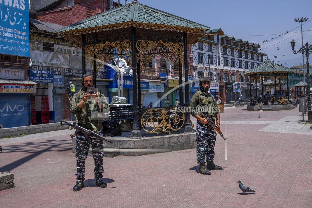Dar Yasin Paramilitary soldiers keep vigil with the help of a drone during shutdown in central Srinagar, Indian controlled Kashmir, Wednesday, May 25, 2022. Shops and business establishment in some parts of Srinagar remained closed ahead of the sentence hearing of Kashmiri separatist leader Yasin Malik. Malik is being tried on charges of terrorist acts, raising funds, conspiracy, a member of a terrorist organization, and criminal conspiracy and sedition.(AP Photo/Dar Yasin)
