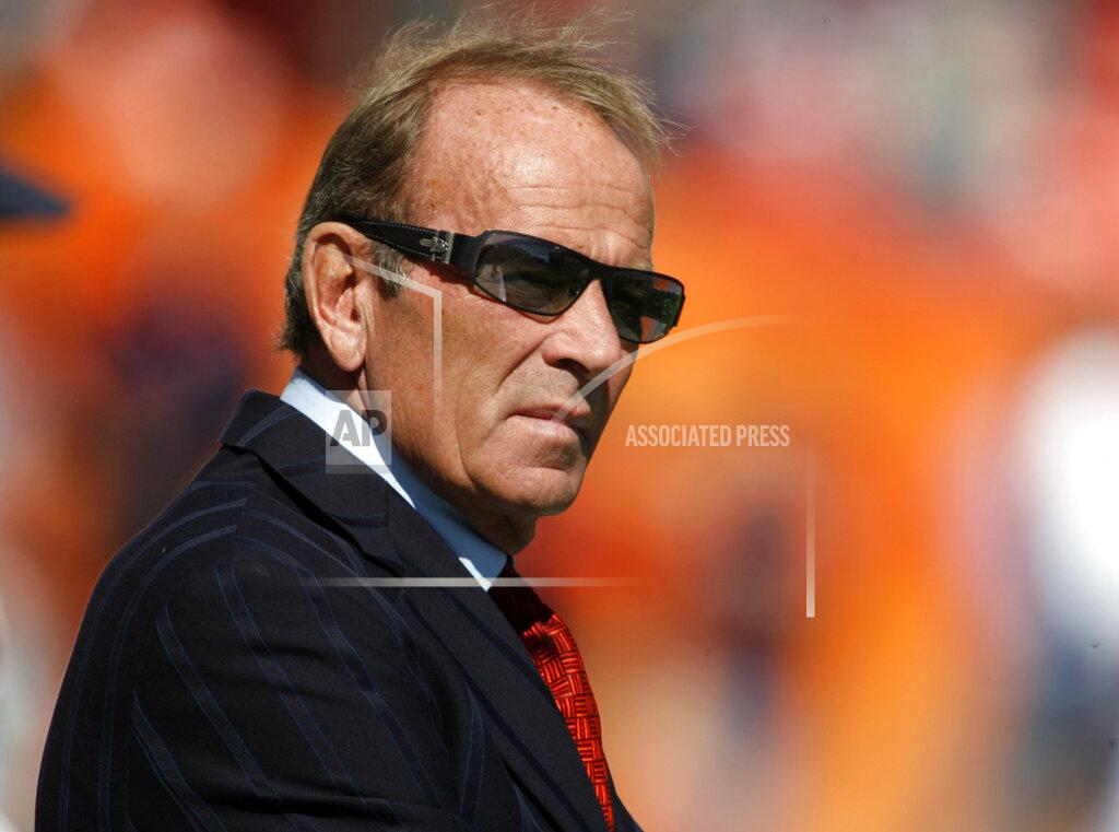 David Zalubowski FILE - In this Oct. 7, 2007, file photo, Denver Broncos owner Pat Bowlen looks on during pre-game warmups before the Broncos play the San Diego Chargers in an NFL football game in Denver. The late Pat Bowlen will be inducted into the Pro Football Hall of Fame in Canton, Ohio on Aug. 3, 2019. (AP Photo/David Zalubowski, File)