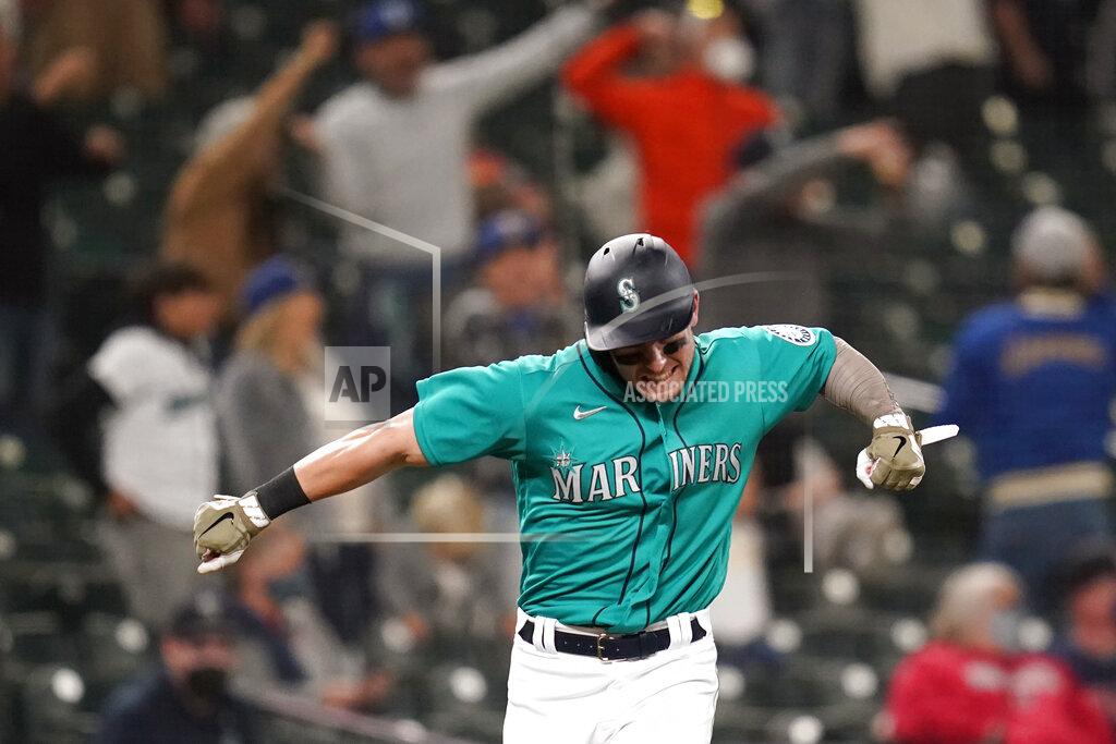 Elaine Thompson Seattle Mariners' Jarred Kelenic reacts to the home run of Mitch Haniger as he heads in to score against the Cleveland Indians during the seventh inning of a baseball game Friday, May 14, 2021, in Seattle. (AP Photo/Elaine Thompson)